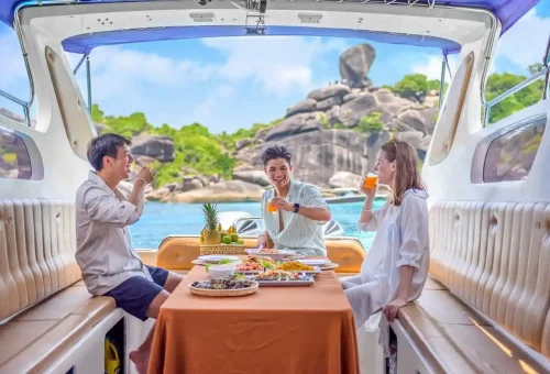 Travelers enjoying private lunch onboard a luxury speedboat at Similan Islands