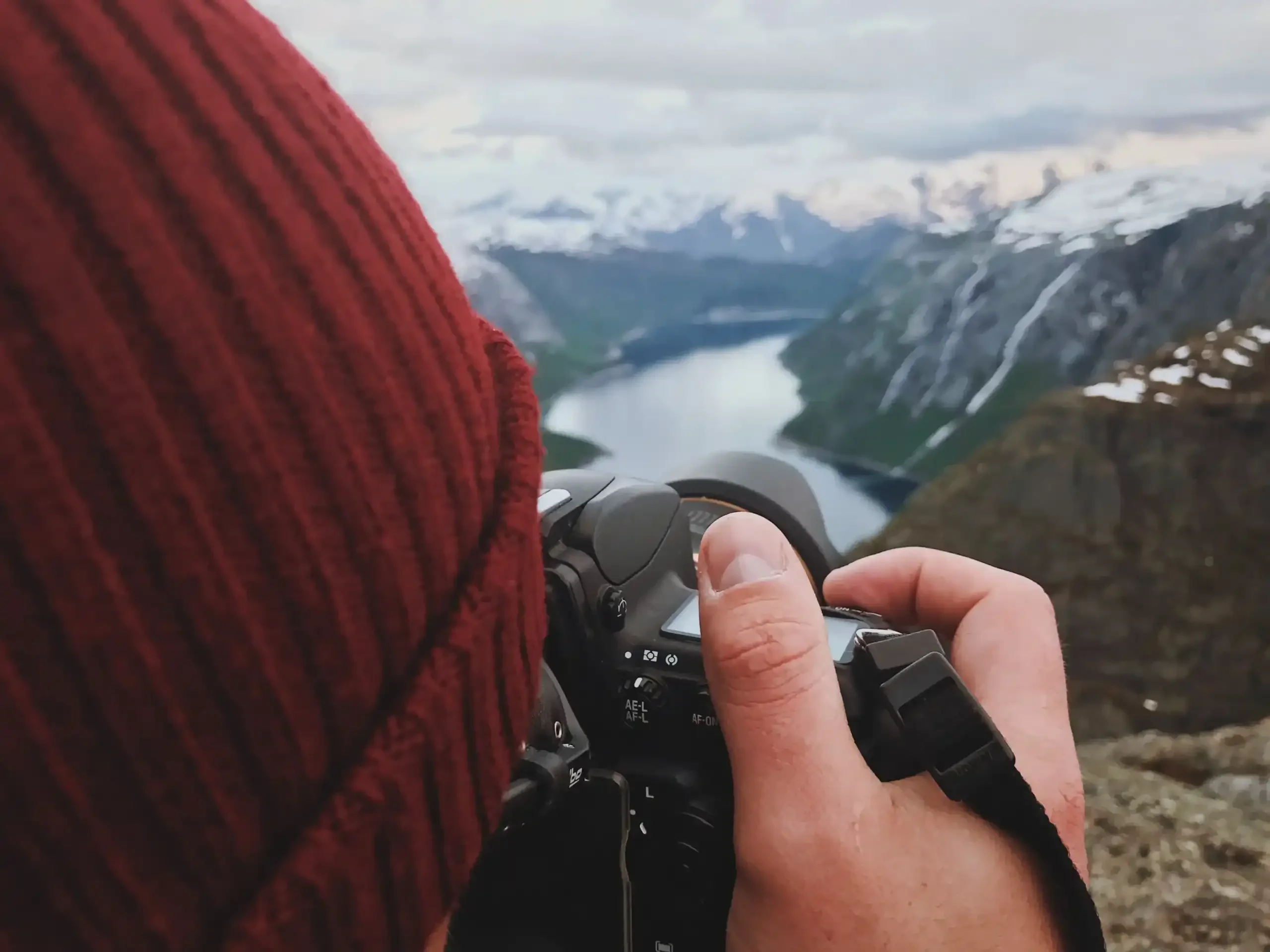 man-takes-picture-gorgeous-scandinavian-landscape-min-scaled