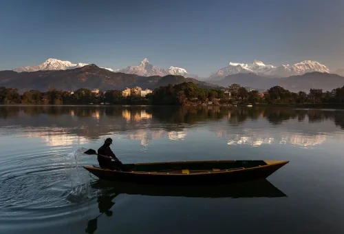 pokhara lake and a boatman